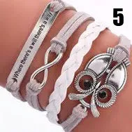 Handmade leather braided bracelet with variety of charms