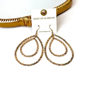 Layered Faux Navajo Pearl Beaded Teardrop Earrings with Champagne Glass Spacers in Gold Tone