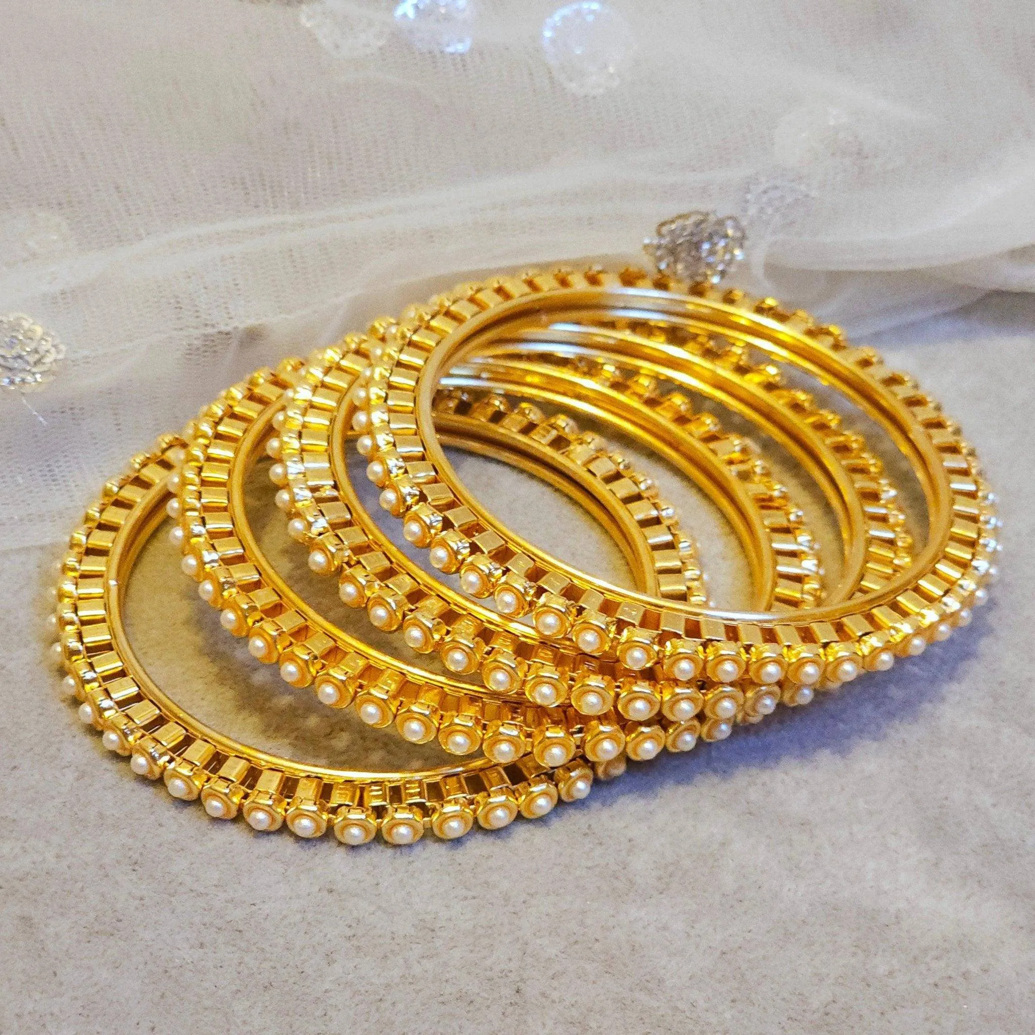 Set of 4 Elegant Pearl Bangles for a Touch of Class  Perfect for Any Occasion