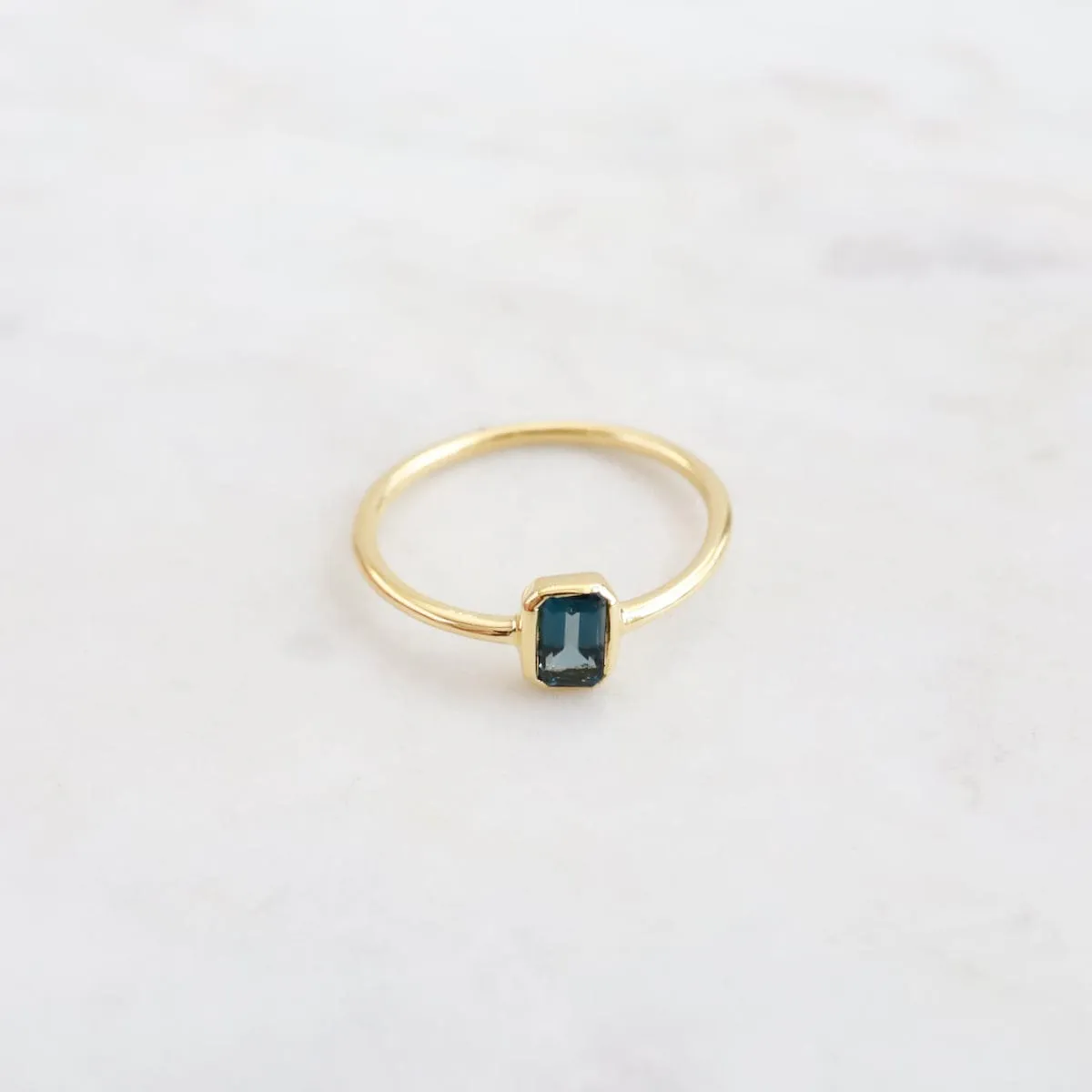 Vertical Bezel Set Emerald Cut London Blue Topaz Ring